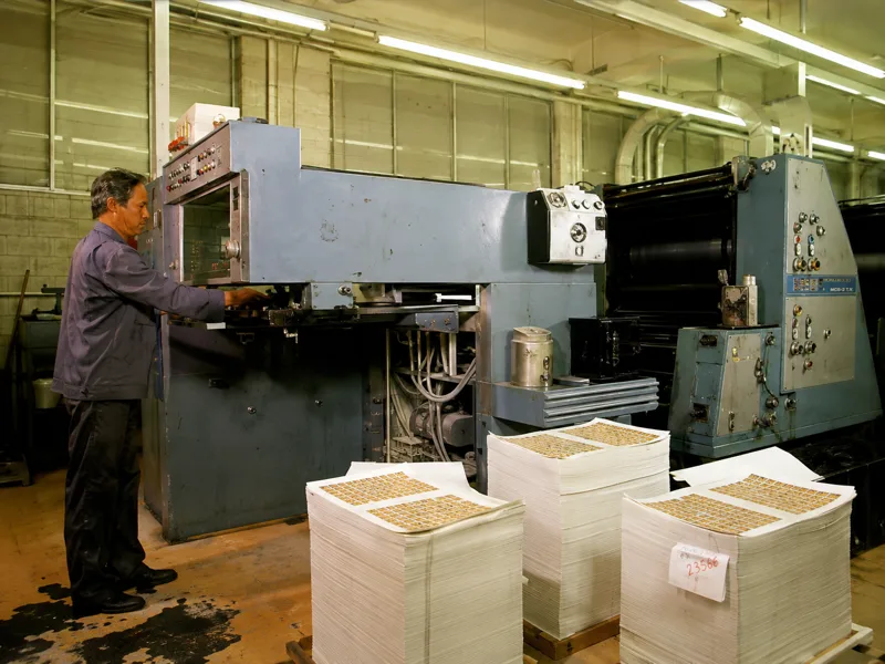 6. Sheets of stamps are guillotine cut into modules.