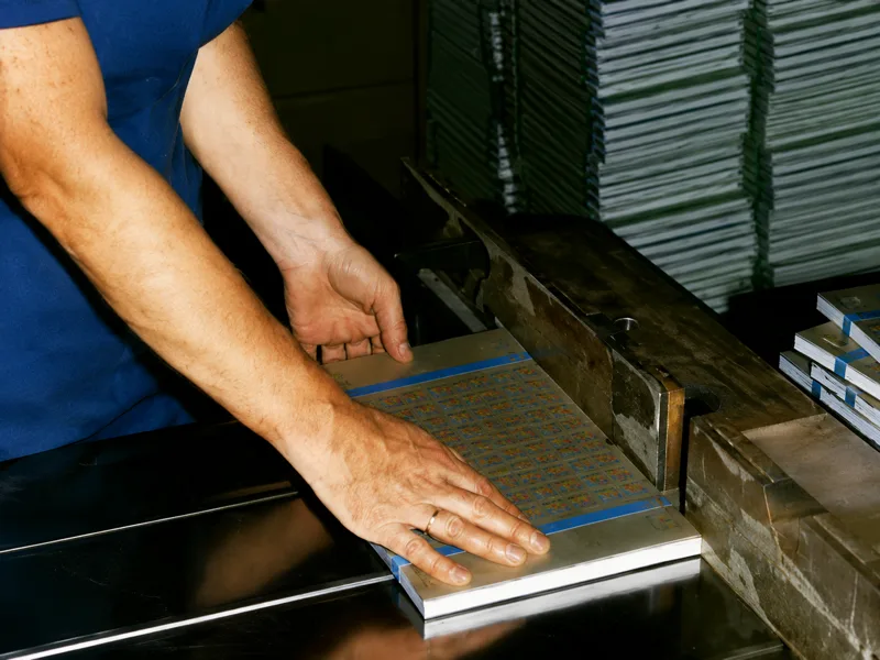 8. Sheets of stamps are strapped into bundles for delivery.